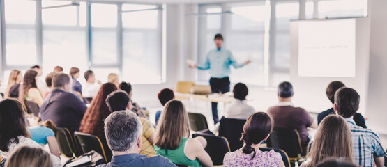 Speakers Giving a Talk at Business Meeting. Audience in the conference hall. Business and Entrepreneurship concept.
