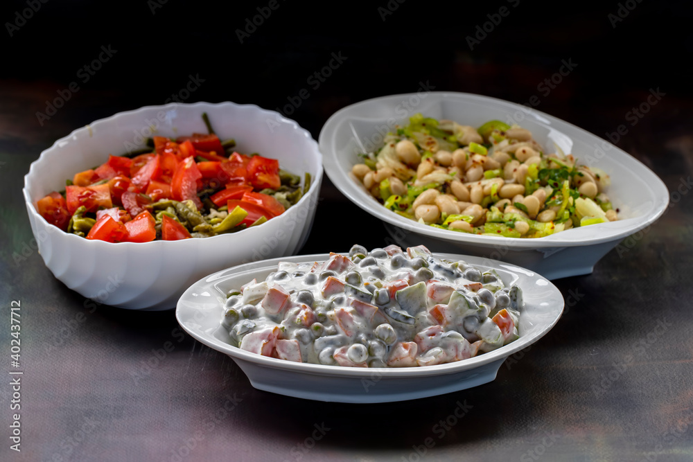 Russian salad made with peas, carrots, pickles, potatoes, mayonnaise, appetizer. Russian salad made with peas, carrots, pickles, potatoes, mayonnaise, appetizer.