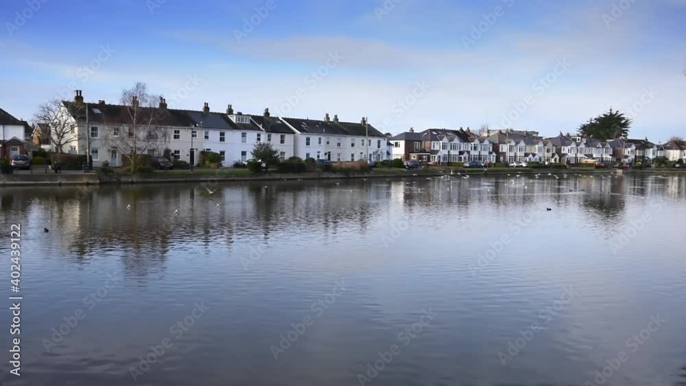 Beautiful Slipper Mill Pond in Emsworth with reflections in the water of cottages and houses along the far side. Beautiful Slipper Mill Pond in Emsworth with reflections in the water of cottages and houses along the far side.