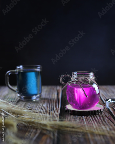 colored glass jars on a wooden table