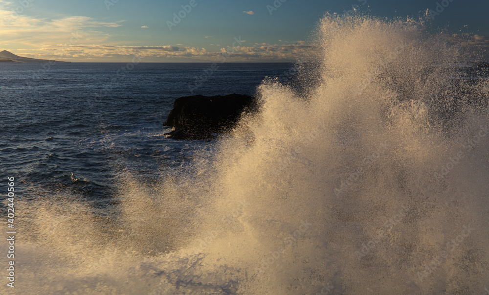 Powerful foamy ocean waves waves are breaking along Las Canteras and El Confital town beaches in Las Palmas de Gran Canaria