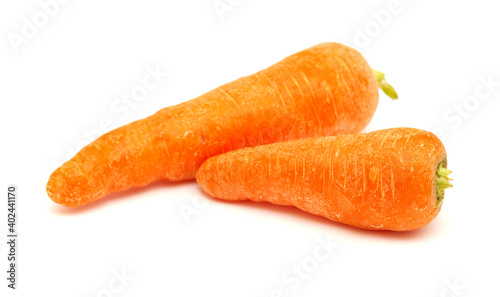 Large soil grown carrots isolated on white background 