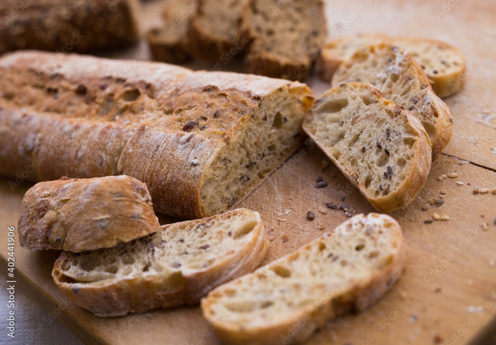 fresh loaf of bread on wooden board