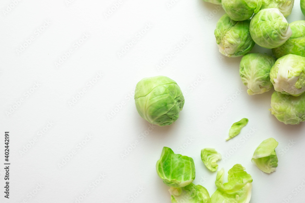 ripe Brussels sprouts lie on the table, next to its leaves ripe Brussels sprouts lie on the table, next to its leaves