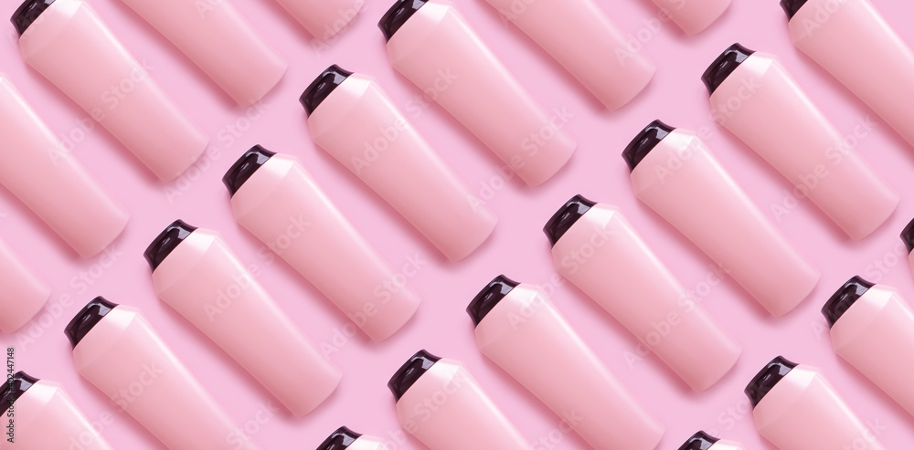 Obraz premium bottle of shampoo and balm on a colored pink background