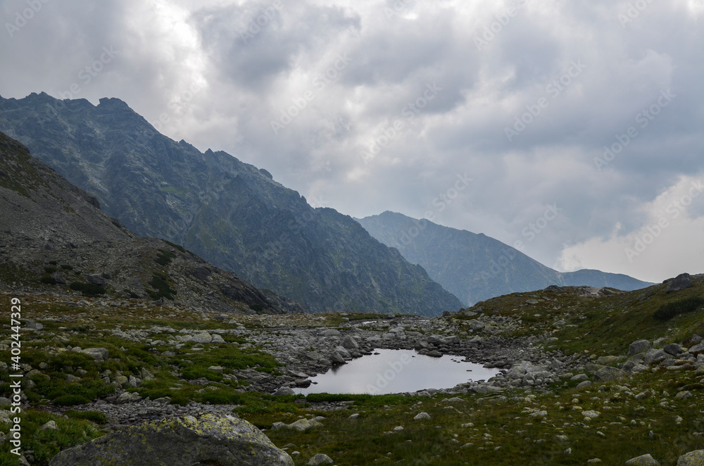 View of the Mengusovska valley in the mountains near the Hincovo pleso pond in the High Tatras. Slovakia. Hiking and travel destination View of the Mengusovska valley in the mountains near the Hincovo pleso pond in the High Tatras. Slovakia. Hiking and travel destination