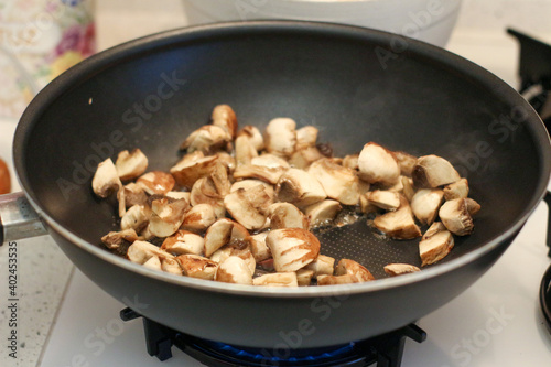 mushrooms in a pan. sauté , mushrooms. Organic food.