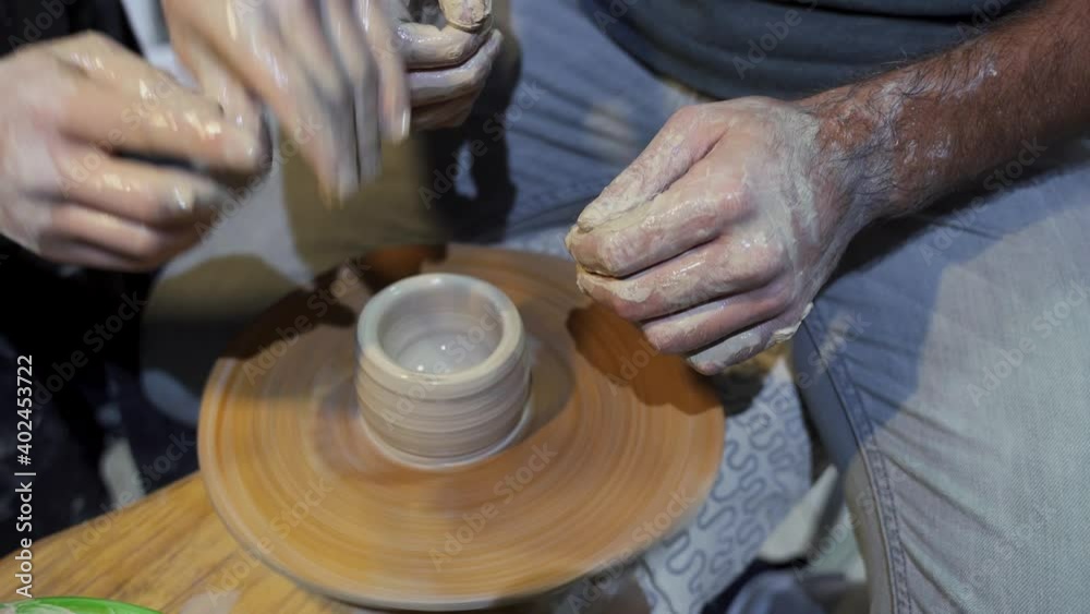 Making a handmade clay pot in the workshop. Pottery lesson with master. Making a handmade clay pot in the workshop. Pottery lesson with master.
