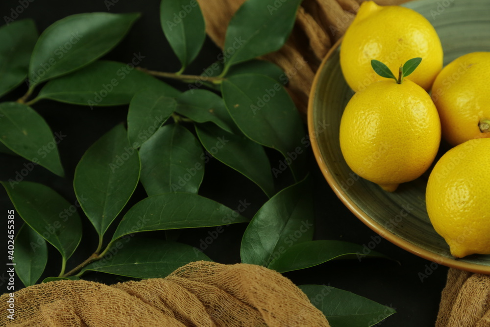 Group of lemons with leaves, isolated on background