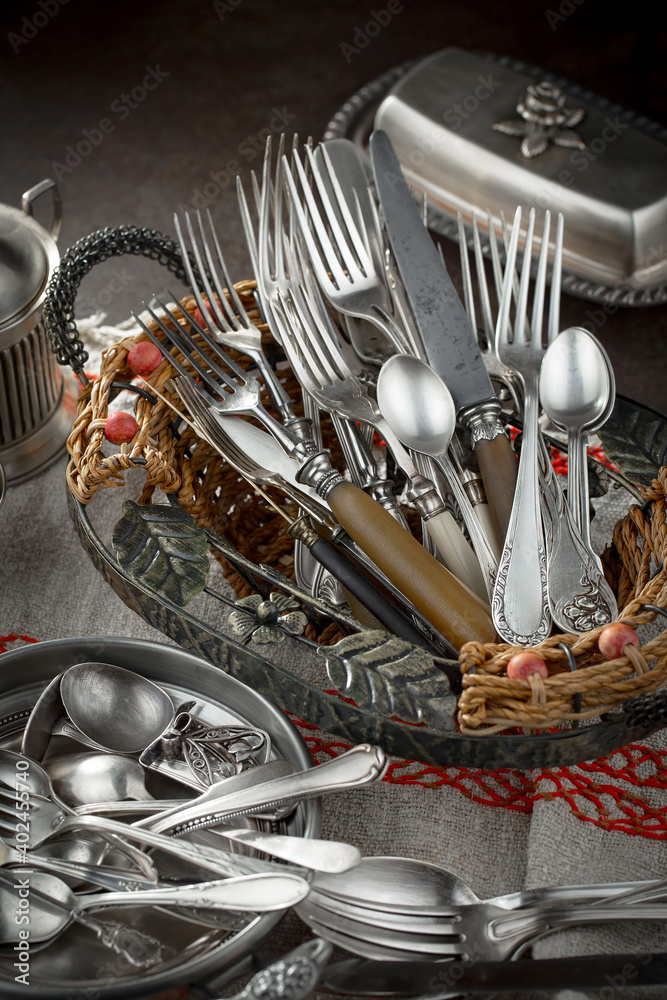 Silver dishes on old background Silver dishes on old background