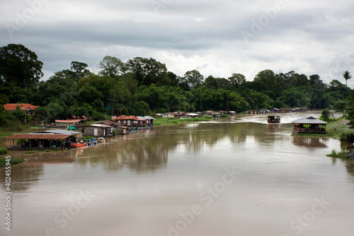 View landscape water flowing and life of thai people fishery with travel wooden ship bring travelers people travel visit Uthaithani city at riverside of Sakae Krang river at in Uthai Thani Thailand