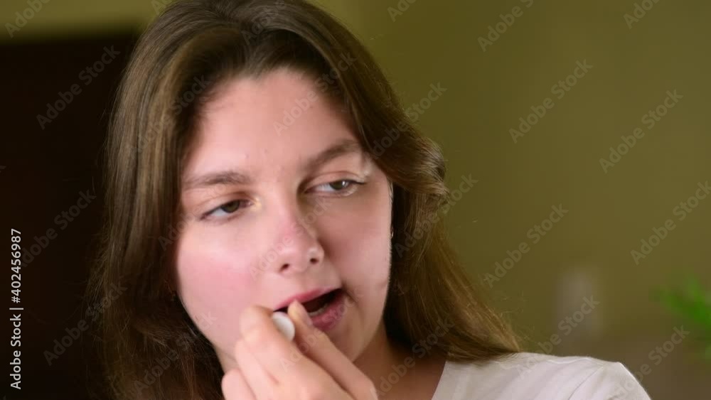 4k Happy attractive young woman putting lipstick, natural no make-up make up, beauty routine, looking in mirror enjoy natural beauty, zoom in