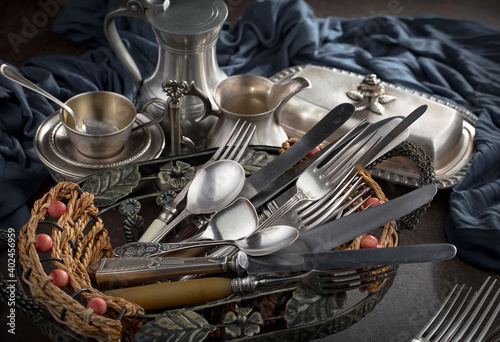 Silver dishes on old background © vizafoto