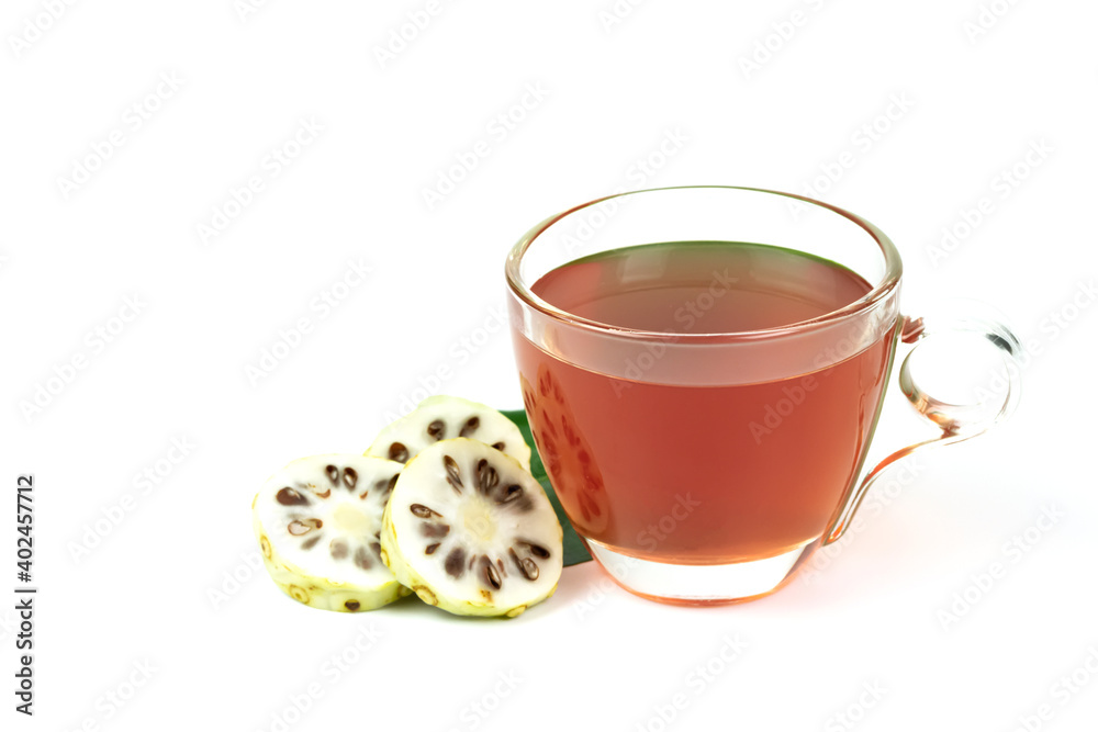 Noni juice and noni fruit sliced isolated on white background. Healthy concept.
