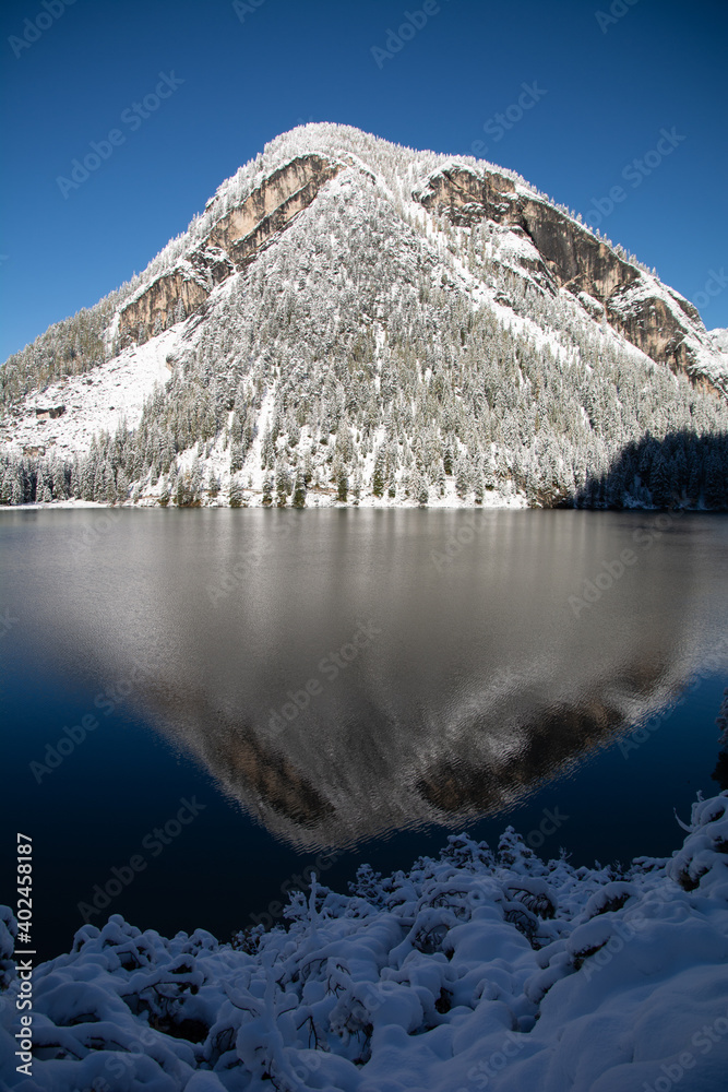 Fototapeta premium Lake Prags - first snow in a winter wonderland