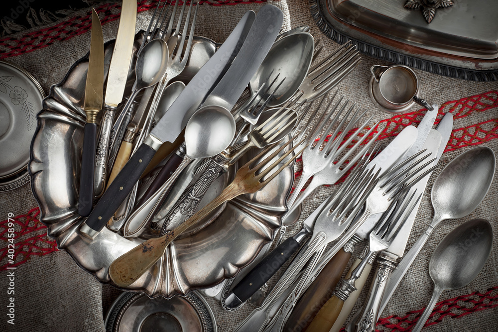 Silver dishes on old background Silver dishes on old background