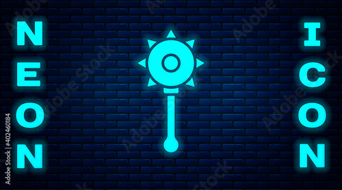 Glowing neon Medieval chained mace ball icon isolated on brick wall background. Medieval weapon. Vector.