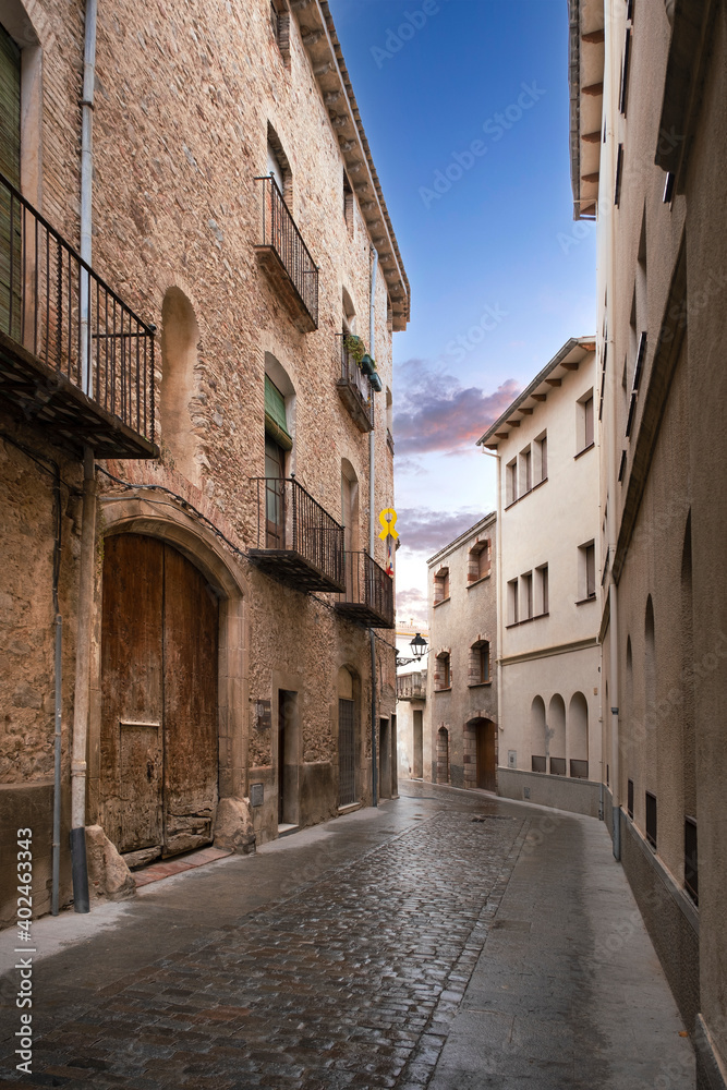 Old town street with cobblestones in Caldes de Montbui.  Empty copy space for Editor's content.