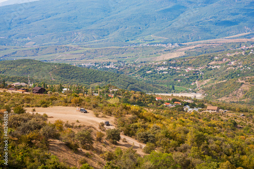 View on a green valley with mountain background