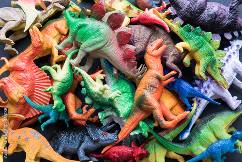 Pile of toy plastic dinosaurs