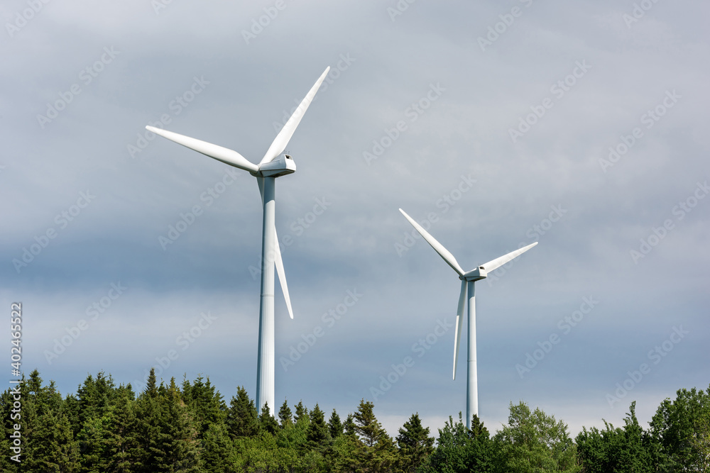 Close-up of two white wind turbines Close-up of two white wind turbines