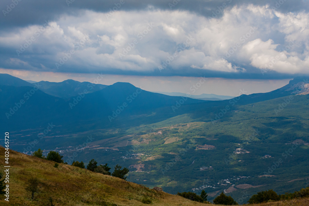 View on a green valley with mountain background