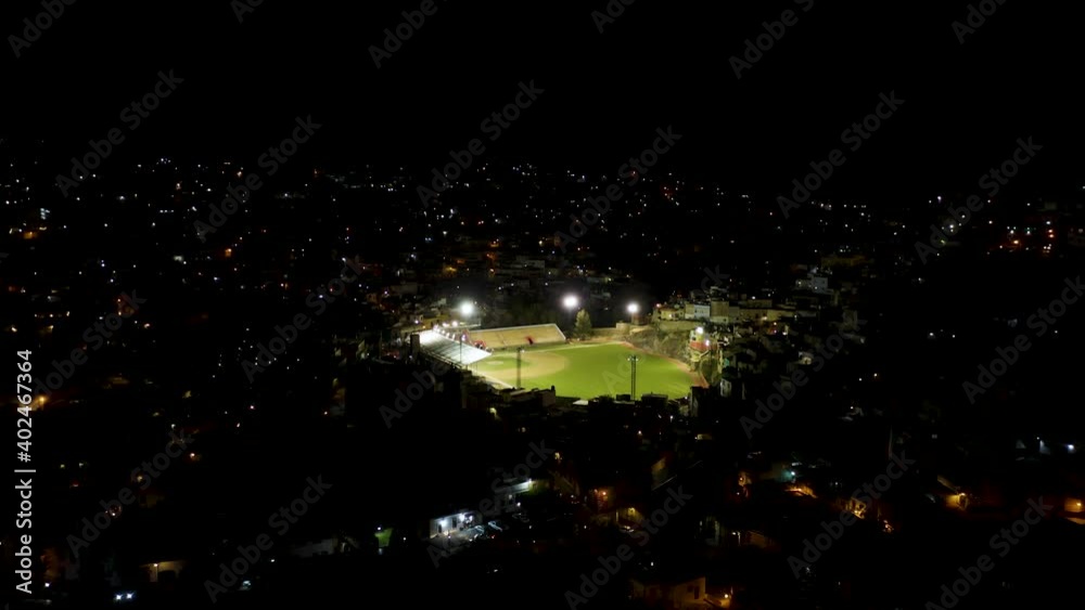 Drone Flies Toward Baseball Stadium at Night. Densely Populated Central American City. Drone Flies Toward Baseball Stadium at Night. Densely Populated Central American City.