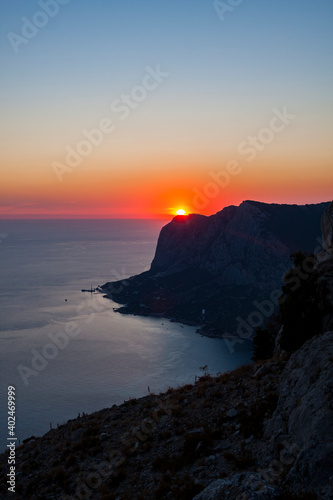 silhouette of the bay coast at red sunset view from the top