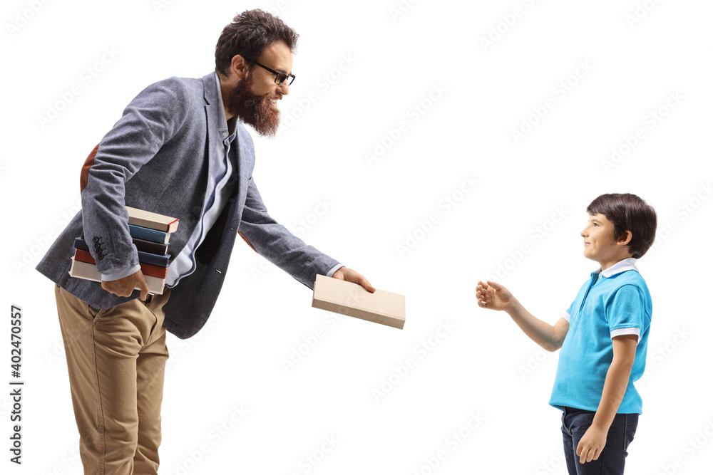 Man giving a book to a boy Man giving a book to a boy