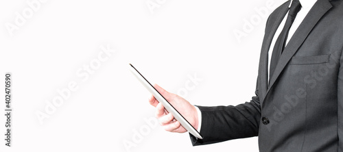 Businessman reading on a tablet pc at the office
