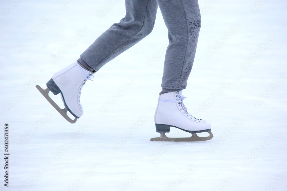ice skating woman legs on ice rink. hobbies and winter sports