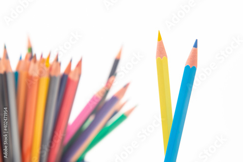 set of colored pencils for drawing on a white background. marketing in business sales