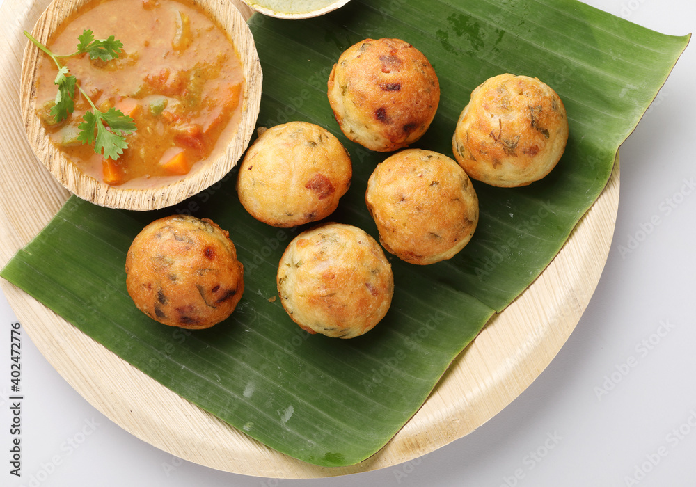 Kuzhi Paniyaram served with coconut chutney and sambar South Indian