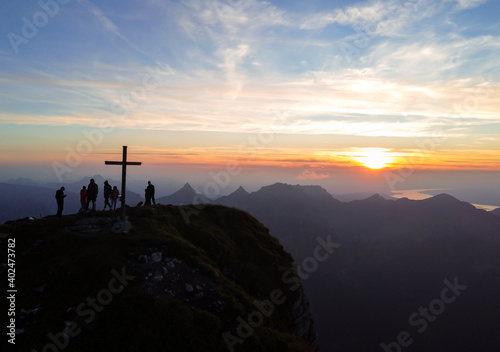 Awesome sunset with mountains and a cross