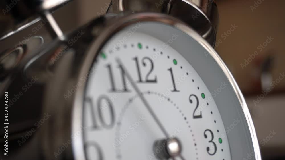 Big metallic clock close up. Time or showing time concept. Classic retro mechanical alarm clock with ringer. Time passing or waking up in the morning. 4k video Big metallic clock close up. Time or showing time concept. Classic retro mechanical alarm clock with ringer. Time passing or waking up in the morning. 4k video