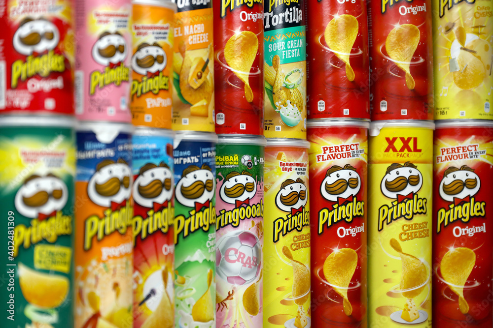 Pringles variety of flavors. Many cardboard tube cans with Pringles ...