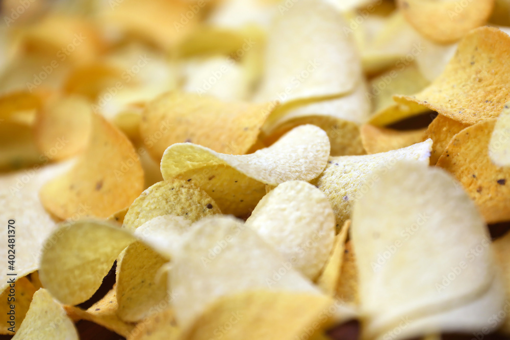 Many orange Pringles potato snack chips. Pringles is a brand of potato ...