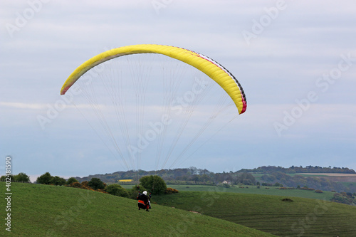 Tandem paraglider above the Pewsey Vale at Golden Ball 