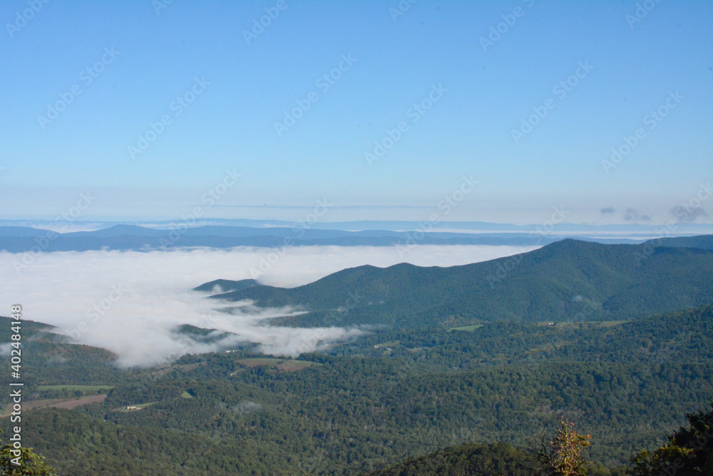 View of the blue ridge mountains and clouds over the valley as seen from Shenandoah National Park