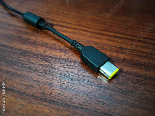 notebook charger tip with yellow tip.