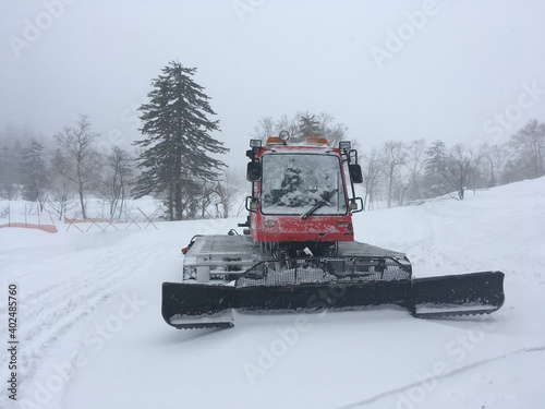 Snow cat snow plow in a field of snow in Japan