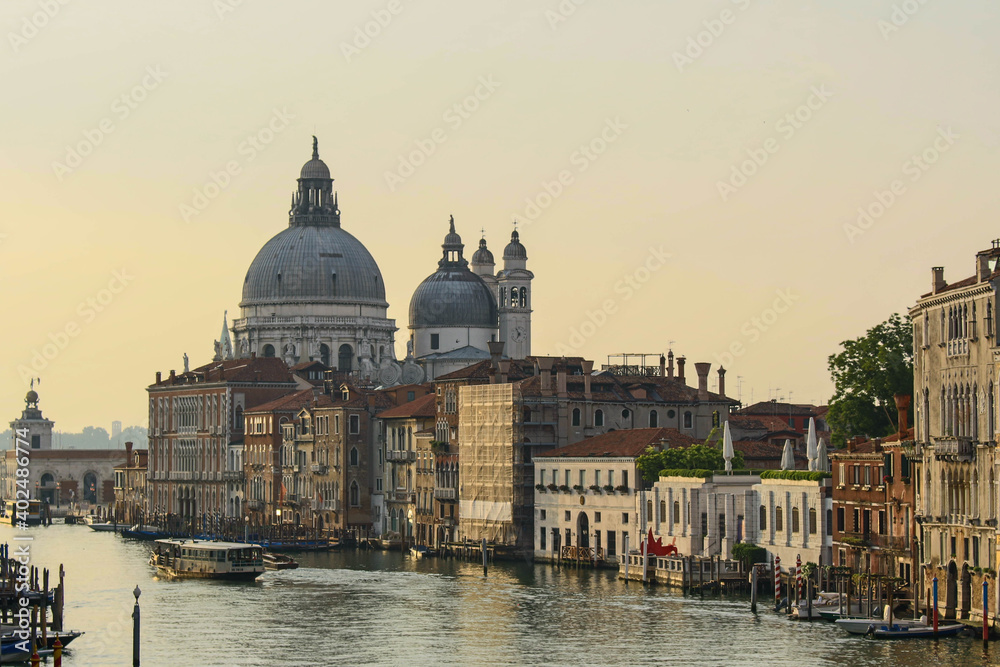 Summer in Venice, European vacation, Sunrise in Italy overlooking the Grand Canal with Church Dome in background