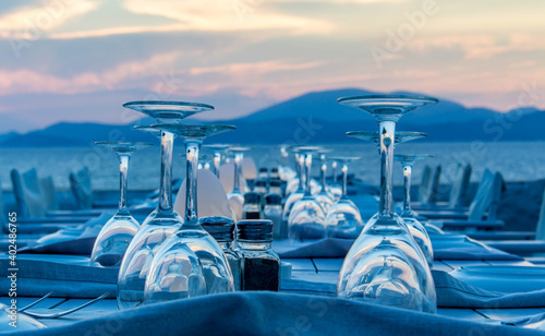 Dinner by ocean with sunset view, Greek summer vacation