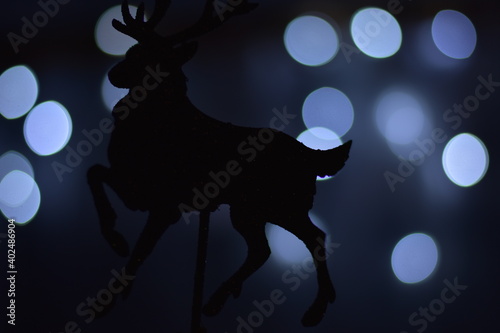 Fototapeta Naklejka Na Ścianę i Meble -  reindeer on the background of lights