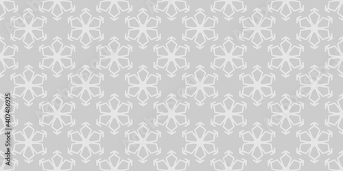 Simple white ornament on a gray background in Asian style. Seamless wallpaper texture