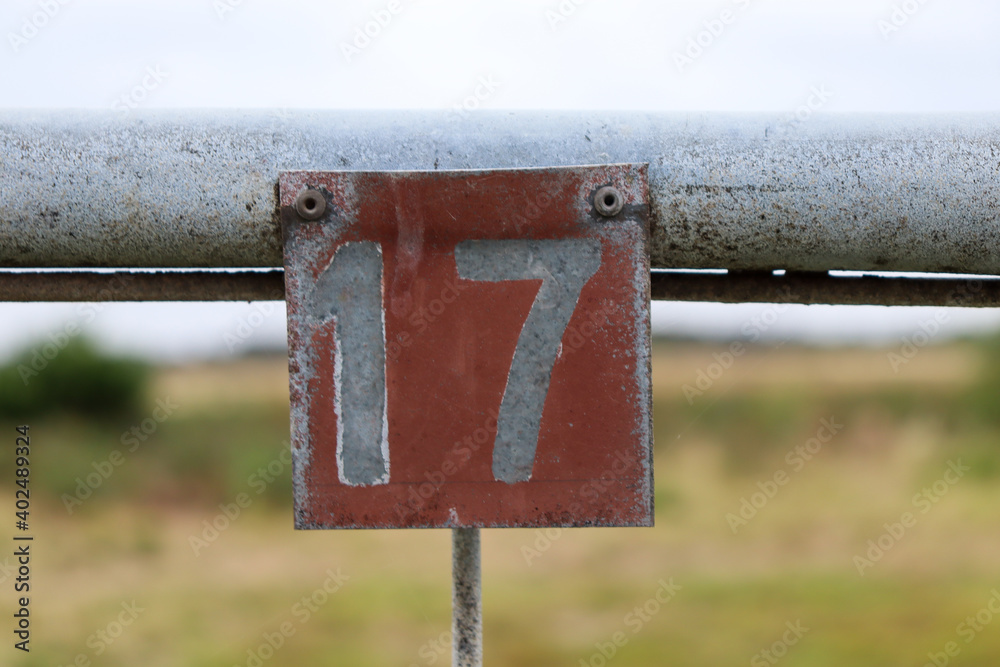 number seventeen on fence - obrazy, fototapety, plakaty 