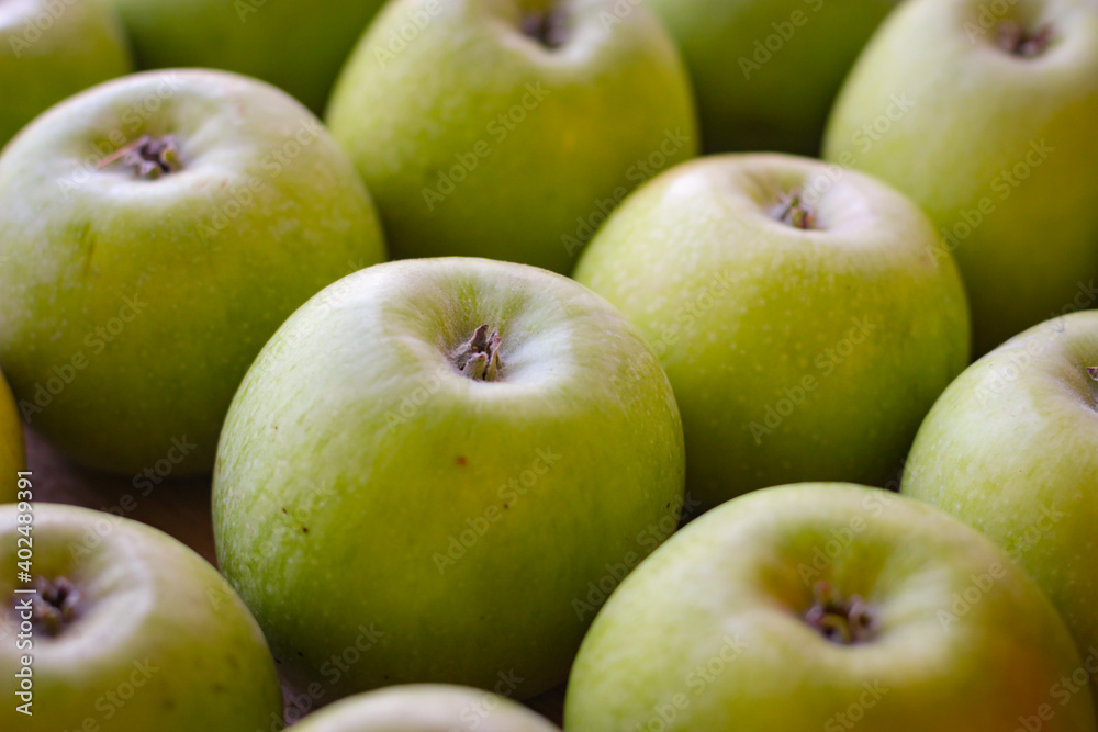 Apples stand on a wooden surface Apples stand on a wooden surface