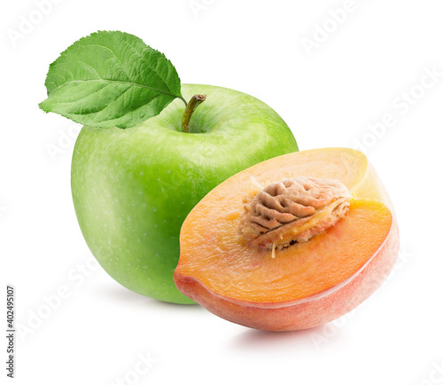 green apple with leaf and half of peach isolated on a white background