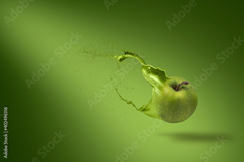 Green apple with paint splash on the air, The rose stated green apple.