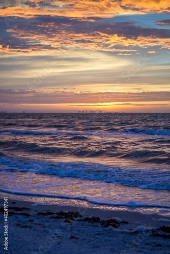 Brilliant colorful sunrise over ocean waves along the beach at Sanibel Island  Florida before Hurricane Ian